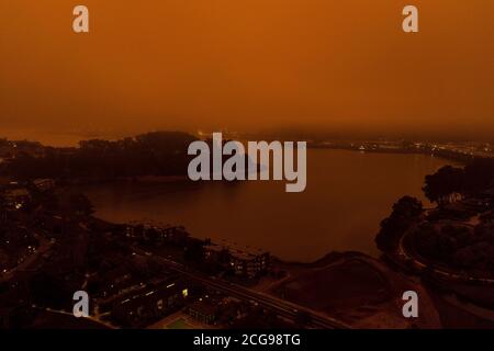Tiburon, USA. 09th Sep, 2020. SAN FRANCISCO, CA - SEPTEMBER 9: Orange Fog caused by the 2020 california wildfires and a dense marine layer shrouds Bay Area mixing to make a very eerie and apocalyptic scene of the San Francisco view as shot without a filter from a drone above the tiburon peninsula. Photo: Casey Flanigan/imageSPACE Credit: Imagespace/Alamy Live News Stock Photo