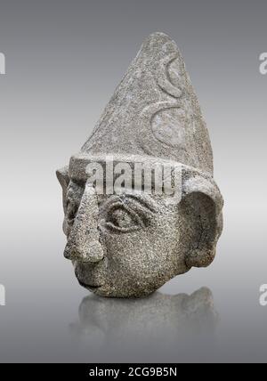 Hittite statue head of a god, Hittite capital Hattusa, Hittite Middle Kingdom 1650-1450 BC, Bogazkale archaeological Museum, Turkey. Grey background Stock Photo