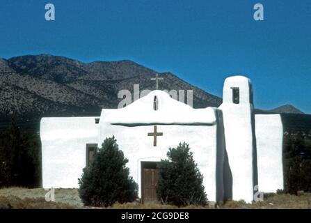 View of the San Francisco church in Golden, NM with the San Pedro Mountains in the background. The church was built in the 1820s. ca. 2004-2007 Stock Photo