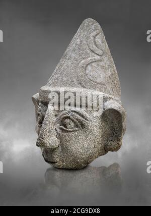 Hittite statue head of a god, Hittite capital Hattusa, Hittite Middle Kingdom 1650-1450 BC, Bogazkale archaeological Museum, Turkey. Grey background Stock Photo