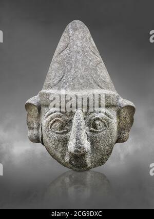 Hittite statue head of a god, Hittite capital Hattusa, Hittite Middle Kingdom 1650-1450 BC, Bogazkale archaeological Museum, Turkey. Grey background Stock Photo