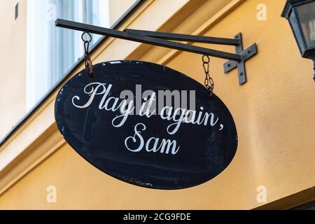 Play it again, Sam. Hanging sign over vintage and second-hand clothing shop entrance in Kruununhaka district of Helsinki, Finland. Stock Photo