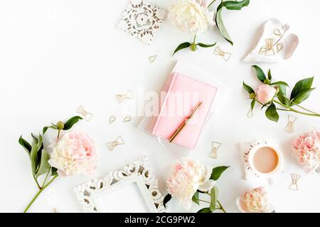 frame made of beautiful pink peonies on wooden white background. Flat lay, top view. Valentine's background. Floral frame. Frame of flowers.  Stock Photo