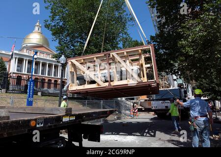 Removal for off site restoration of the historic Shaw 54th Memorial bronze relief outside the Statehouse in Boston, Massachusetts, USA Stock Photo