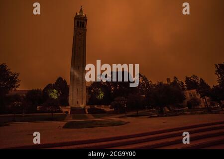 The Campanile clock tower on the campus of UC Berkeley, taken at 10 AM when smoke from the California wildfires filled the air with smoke and smog. Stock Photo