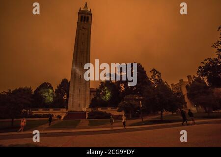 The Campanile clock tower on the campus of UC Berkeley, taken at 10 AM when smoke from the California wildfires filled the air with smoke and smog. Stock Photo