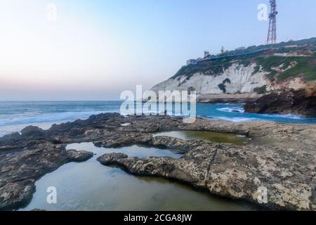 View of the blue hour (after sunset) with the coast and cliffs of Rosh HaNikra, Northern Israel Stock Photo