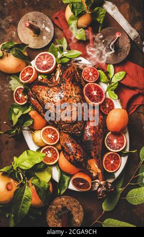 Christmas festive table setting with roasted turkey and candles Stock Photo