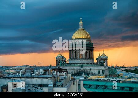 View of St. Isaac's Cathedral, Saint Petersburg city, Russia. Storm clouds on the horizon, beautiful cityscape in a thunder Stock Photo