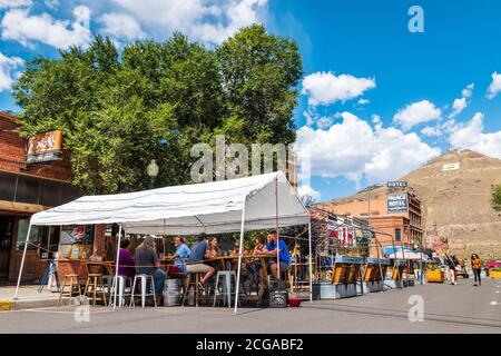 Tourists enjoy a summer day; Bensen's Tavern & Beer Garden; pedestrian only historic F Street; Salida; Colorado; USA Stock Photo