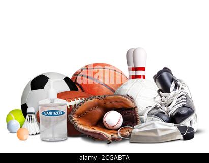 COVID-19 coronavirus new normal and sports concept showing sports equipment, rackets and balls with hand sanitizer and face mask isolated on white bac Stock Photo