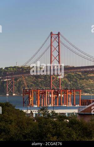 Beautiful view to 25 de Abril Bridge over Tejo River on sunset time, central Lisbon, Portugal Stock Photo