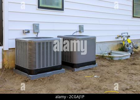 Air conditioning system unit installed outside facade of the new house Stock Photo