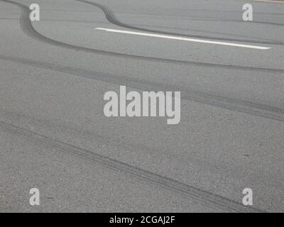 Reckless driving. Car tyre skid marks on a road. Stock Photo