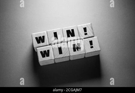 Win Word Written on Wooden Cubes Stock Photo