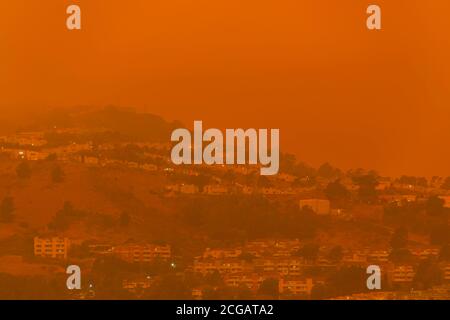 Thick orange haze above San Francisco on September 9 2020 from record wildfires in Californa, daytime view of ash and smoke floating over the Bay Area Stock Photo
