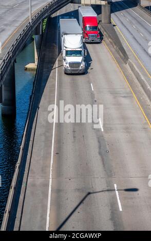 Different long haul diesel Big rigs semi trucks with semi trailers ...