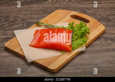 Salted Salmon piece steak served rosemary Stock Photo