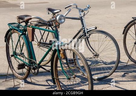 Retro bicycles parked on city street Stock Photo