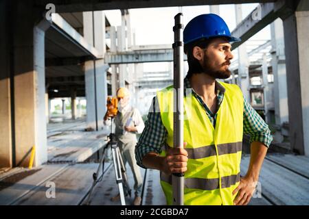 Portrait of construction architect, engineer working on building site Stock Photo