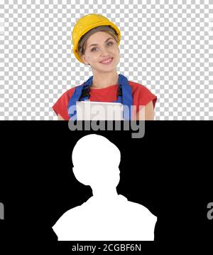 Young construction worker with tablet computer presenting something, Alpha Channel Stock Photo