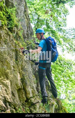 Man doing adventure hike in nature park Altmühltal in bavaria Stock Photo