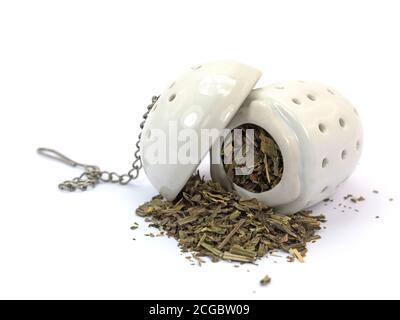 Tea strainer with herbal tea Stock Photo