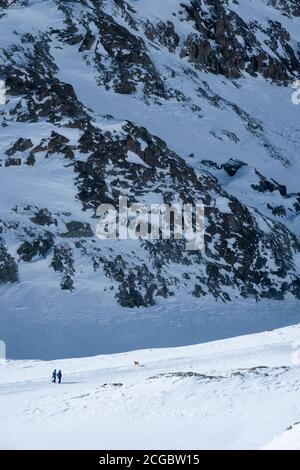 Zermatt, Switzerland - Feb 18 2020: People walking in mountains in the Matterhorn region in winter. Stock Photo