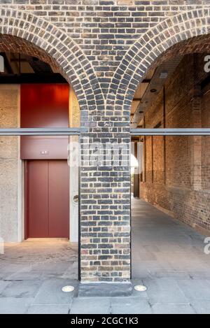 Coal Drops Yard by Heatherwick Studio is a retail district in London King's Cross, UK. Completed in 2018 it's an adaptive reuse project of former coal warehouses. Detail of the lift. Stock Photo