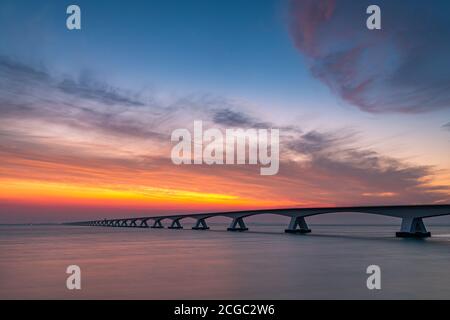 The Zeeland Bridge (Dutch: Zeelandbrug) is the longest bridge in the Netherlands. The bridge spans the Oosterschelde estuary. It connects the islands Stock Photo