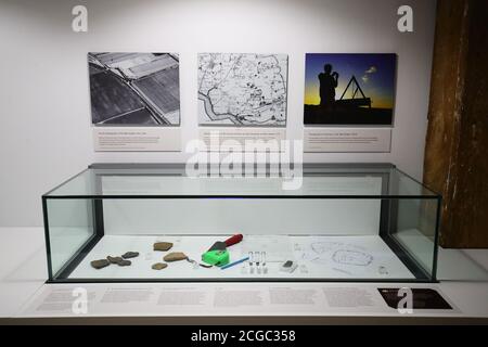 Tools and instruments used to excavate the Bronze Age hoard on display at a preview of the Havering Hoard: A Bronze Age Mystery exhibition at the Museum of London Docklands, east London. The exhibition features a selection of the 453 artefacts from the largest bronze-age hoard to be found in London, which were discovered at a site overlooking the River Thames in 2018. Stock Photo