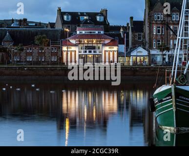 Campbeltown Picture House, Campbeltown, Scotland, UK. Twilight view across harbour. Stock Photo