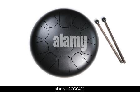 Top view of  steel tongue drum with drum sticks on white Stock Photo
