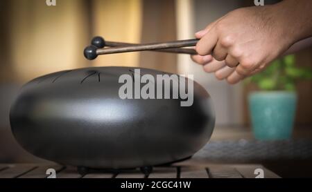 Steel tongue drum rare music playing instrument, made from propane tank and also known as tank drum or hank drum similar to Pantam. Selective focus an Stock Photo