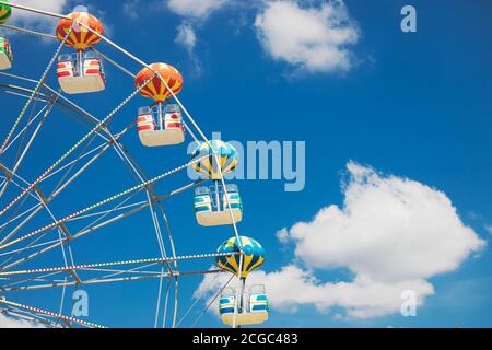 Ferris Wheel with Blue Sky and clouds Stock Photo