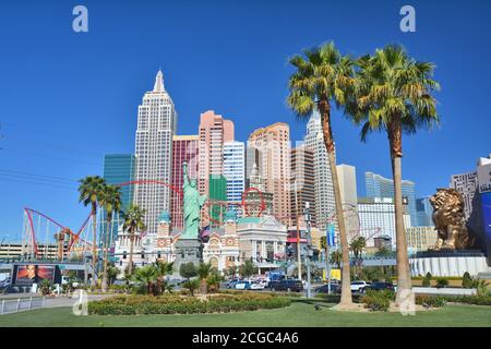 LAS VEGAS, USA - MARCH 19, 2018 : New York New York hotel on Las Vegas boulevard (The Strip). Palm trees garden. Stock Photo