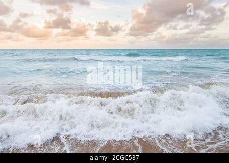 Atlantic Ocean waves crashing on the sandy beach at Recife, Brazil Stock Photo