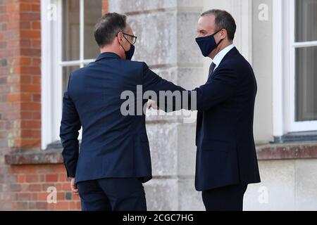Foreign Secretary Dominic Raab (right) greets German Foreign Minister Heiko Maas for an E3 Ministers meeting at Chevening House in Sevenoaks, Kent. Stock Photo
