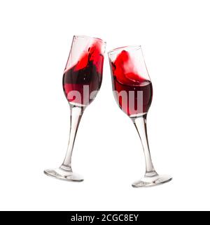 Two wine glasses with vine splashes isolated on white. Stock Photo