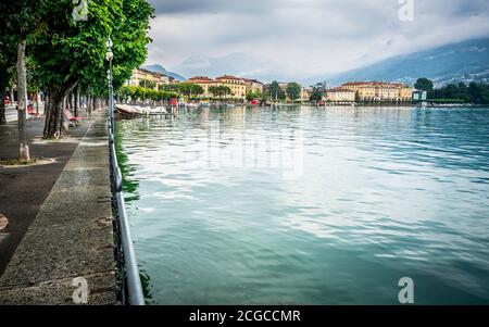 Lugano shoreline with lake view and cityscape on overcast weather day in Lugano Ticino Switzerland Stock Photo
