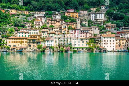 Scenic view of Gandria colorful fishing village houses on the shore of Lake Lugano on beautiful summer day in Lugano Ticino Switzerland Stock Photo