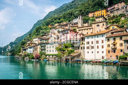 View of Gandria fishermen village with colorful houses on Lake Lugano lakeside on beautiful summer day in Ticino Switzerland Stock Photo