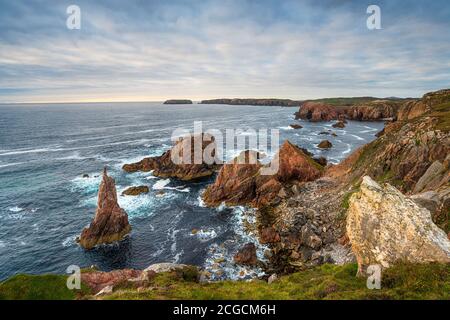 The sea stacks and crumbling cliffs at Mangersta on the Isle of Lewis in the Outer hebrides of Scotland Stock Photo
