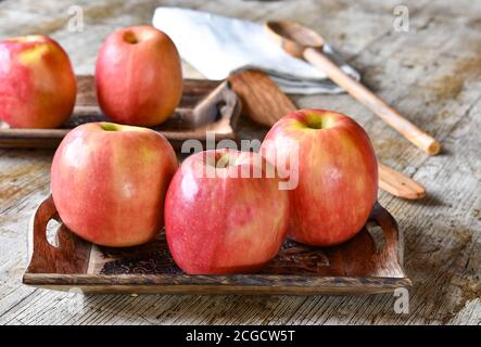 pink apples on a wooden background Stock Photo