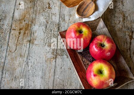 pink apples on a wooden background Stock Photo