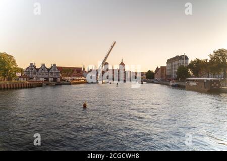 Gdansk, North Poland - August 15, 2020: Polish architecture over motlawa river during sunset Stock Photo