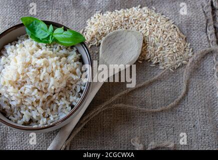 cooked and uncooked brown rice Stock Photo