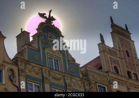 Gdansk, North Poland - August 15, 2020: Polish architecture in the old town at the famous city center against sun Stock Photo