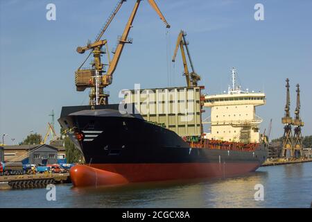 Gdansk, North Poland - August 15, 2020: A huge ship with crane signifying industrial part of gdansk city Stock Photo