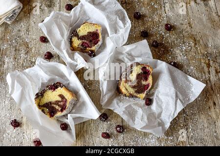 pieces of marble cake on wooden rustic background from above Stock Photo